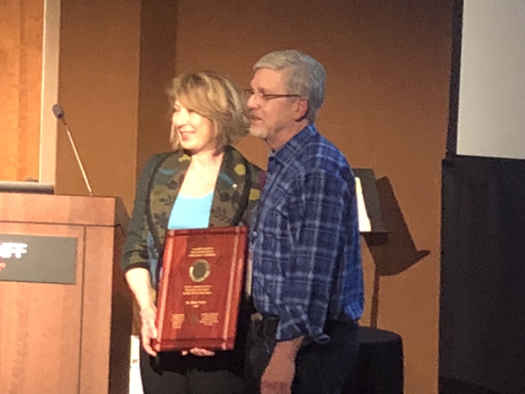 Mona Nemer receives the Arthur Wynne Gold Medal from Phil Hieter in Banff